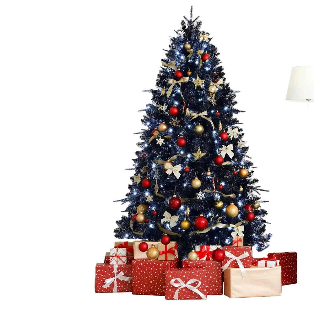 Decorated Christmas tree with ornaments and presents on a white background