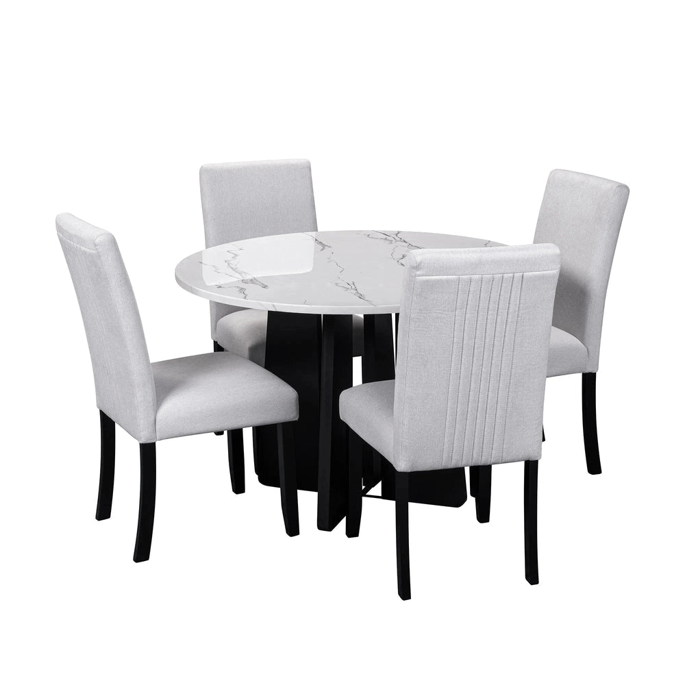 Round marble table with four matching chairs on a white background